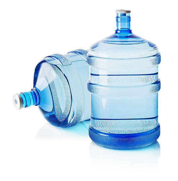 istock Two big bottles of water isolated on the white background 521267427