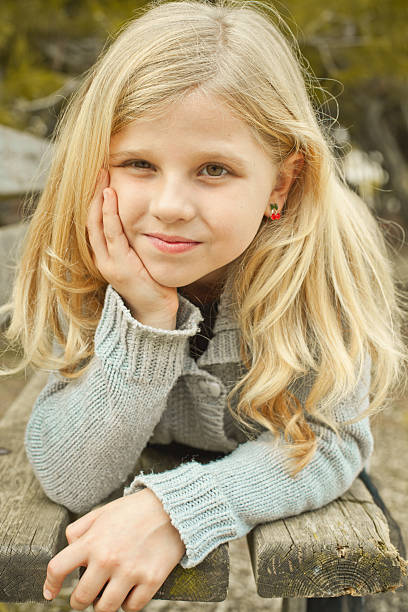 istock pretty girl on a bench 521268235