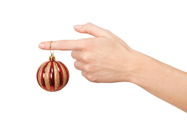 istock Woman's hand holding a Christmas ball 521268543