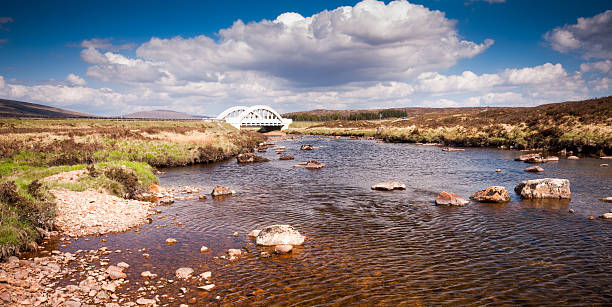 Etive Bridge Crossing the fresh mountain River Etive on the vast expanse of Rannoch Moor in the West Highlands of Scotland on a sunny spring day. etive river photos stock pictures, royalty-free photos & images