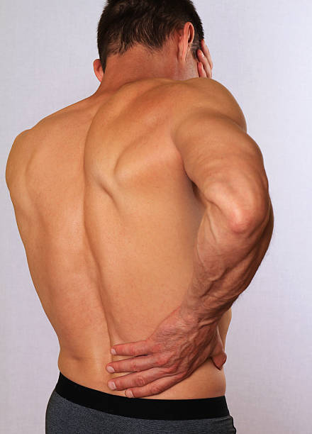istock Man with back pain. Pain relief,  chiropractic concept 521269676