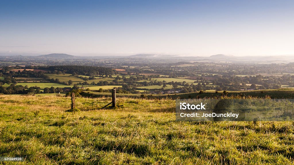 Morning light on the Blackmore Vale Looking over the Blackmore Vale, a rural agricultural valley in North Dorset, from the summit of Okeford Hill in the Dorset Downs. Dorset - England Stock Photo