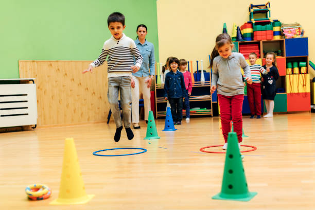 Children Playing Games In Their Kindergarten.