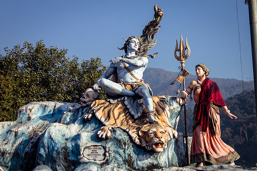 Rishikesh,India - December 31, 2014: Statue of Indian deities Shiva and Parvati in some temple near the river Ganga in Rishikesh. Rishikesh is one of the many sacred places in India and has very serious religious sentiments attached to it. . 