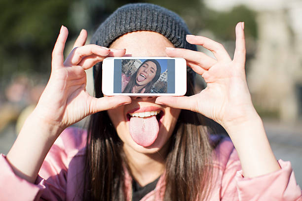 istock Young woman with smart phone in Barcelona, technology. 521271674