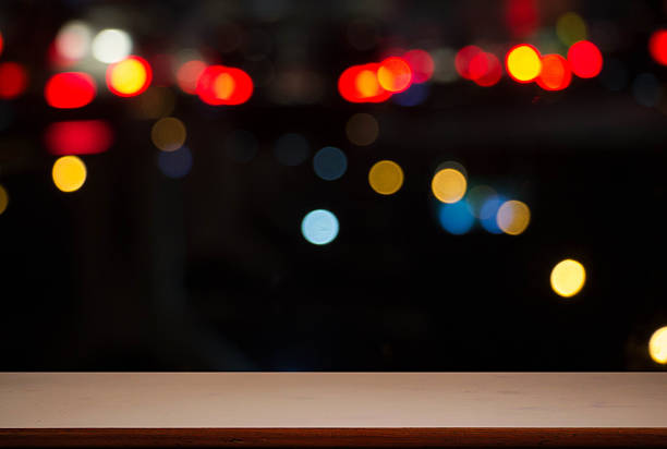 istock Empty wooden table platform and bokeh at nigh 521272584