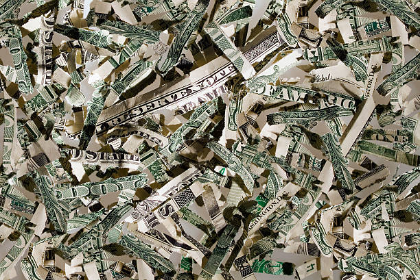 US currency in shreds stock photo