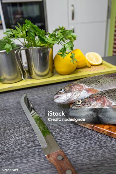 Fresh Trout With Lemon On A Wooden Tray Stock Photo - Download Image Now - Acid, Adult, Apron