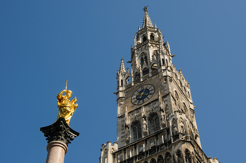 Virgin Mary statue and 96 Meters high neo-Gothic town hall tower on the Munich Marienplatz