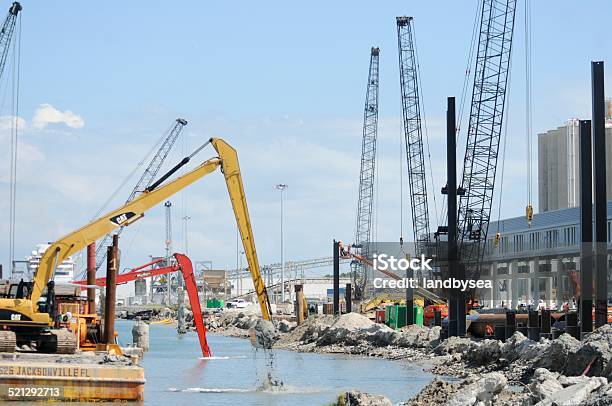 Marine Construction At Port Canaveral Stock Photo - Download Image Now - Backhoe, Barge, Brevard County