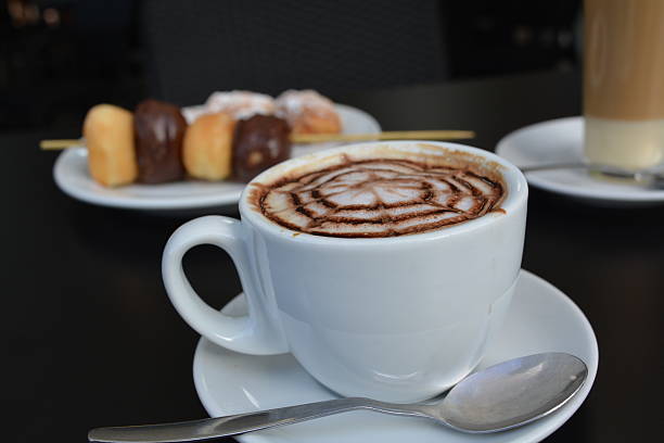 istock Cup Of Cappuccino With Mini Donut 521293087