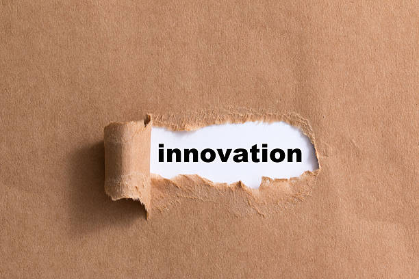 istock word innovation ,ripped paper isolated background 521295019
