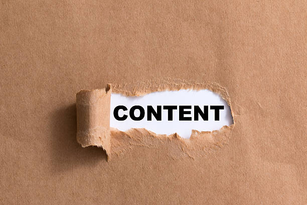 istock word content,ripped paper isolated background 521295111