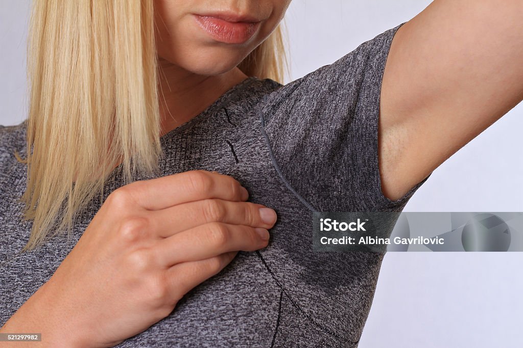 Sport woman armpit sweating. Transpiration stain. Hyperthyroidism concept Sweat Stock Photo