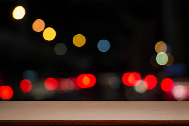 istock Empty wooden table platform and bokeh at nigh 521298426