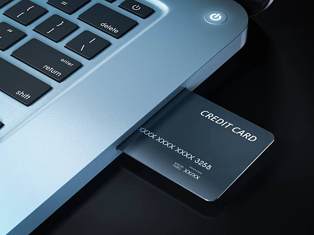 istock on line shopping credit card on laptop 521299040