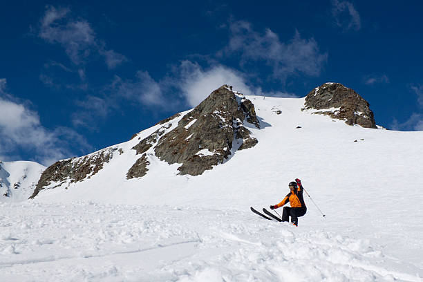 istock skier about to jump in a mountain 521299192
