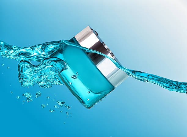 istock The blue jar of moisturizing cream in the blue water wave 521299784