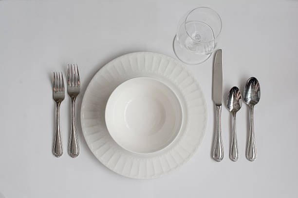 istock Formal Dinner Place Setting Utensils with White Wine Glass 521302294