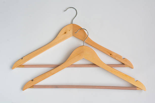 istock Two Over Lapping Wooden Coat Hangers 521302818