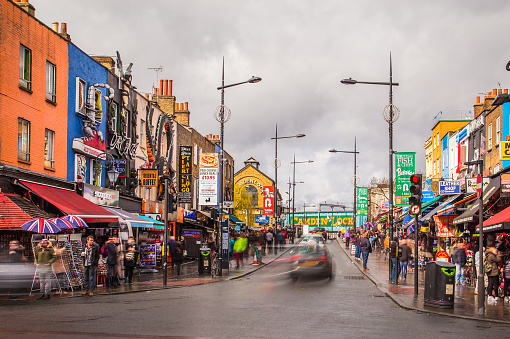 London,UK - March 26, 2015: Camden Town during the day showing buildings, business and the blur of people and traffic