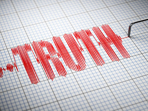 istock Truth concept.  Closeup of a polygraph lie detector with text. 521303554