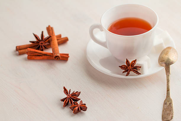 istock cup of tea with teaspoon and cubic sugar 521303782