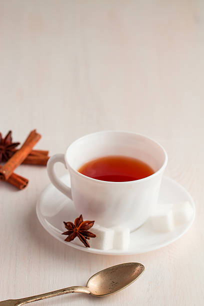 istock cup of tea with teaspoon and cubic sugar 521303858