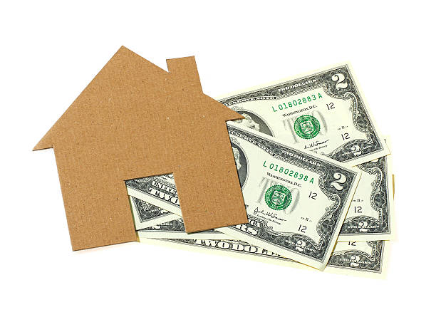 istock home made from paper on money isolated on white background 521303860
