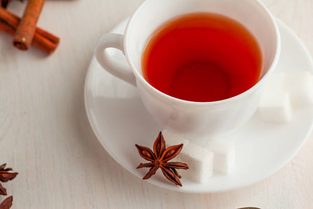 istock cup of tea with teaspoon and cubic sugar 521303930