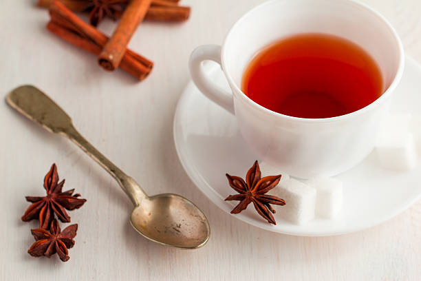 istock cup of tea with teaspoon and cubic sugar 521304008