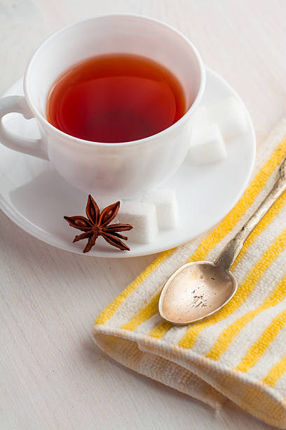istock cup of tea with teaspoon on kitchen towel 521304158