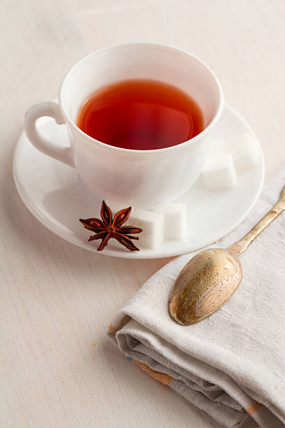 istock cup of tea with teaspoon on kitchen towel 521304240
