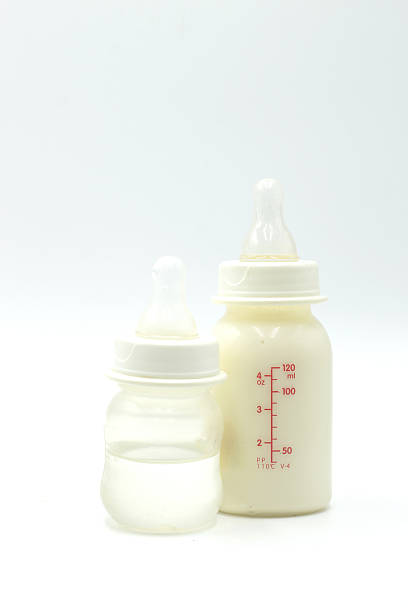 istock milk and water baby bottle 521304612