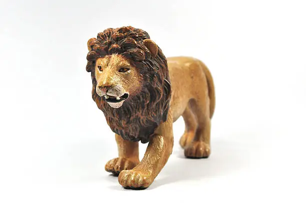Plastic Toy Lion on White Background.