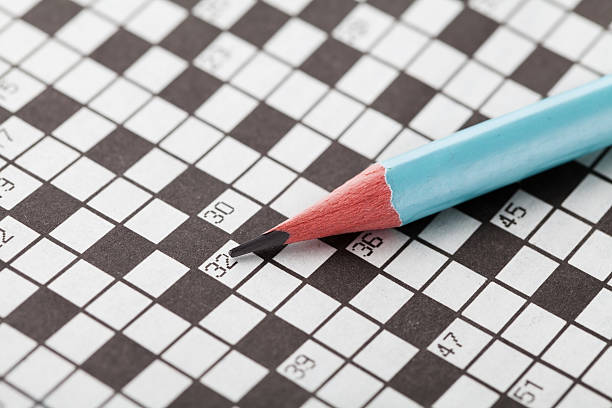 istock Crossword puzzle and blue pencil 521305582