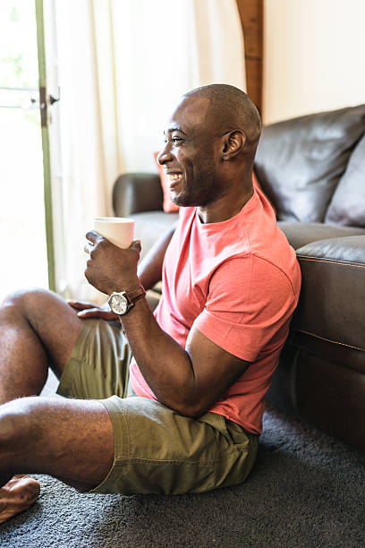 istock man realxing drinking the coffee on living room 521309674