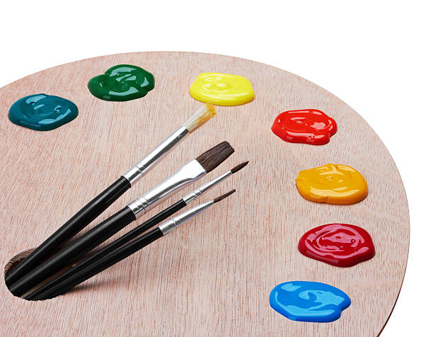 istock Wooden art palette with paints and brushes 521310102