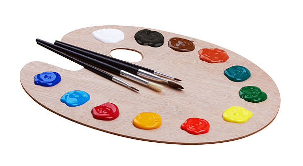 istock Wooden art palette with paints and brushes 521310298