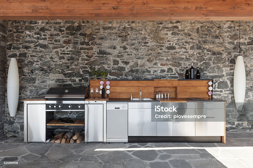 Modern kitchen, outdoor House, modern kitchen with barbecue on the veranda Outdoors Stock Photo