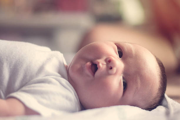 istock Baby boy looking somethings in blurred warm tone concept 521311464