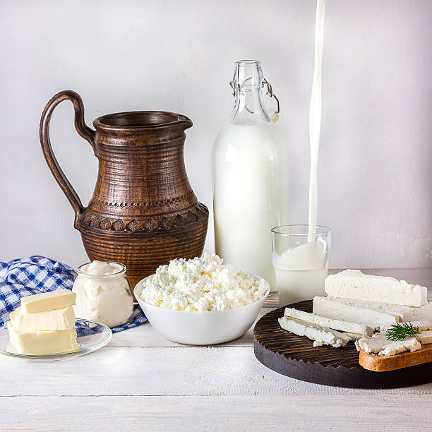 istock dairy products on white wooden table 521312124