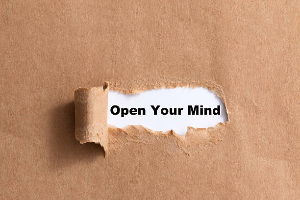 istock sentence open your min ripped paper isolated background 521316621