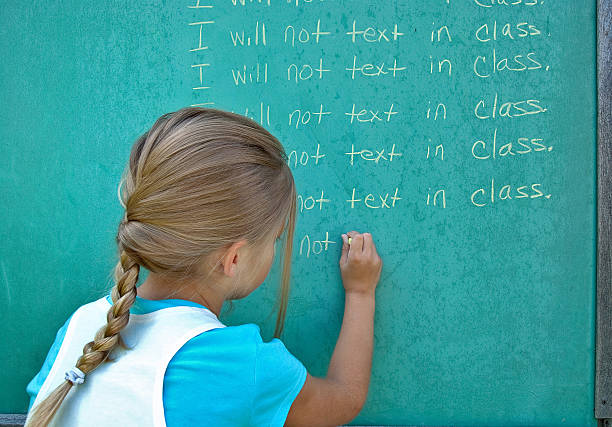 istock little girl writing lines 521317397