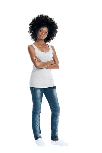 African woman with funky afro and casual clothing arms crossed in studio