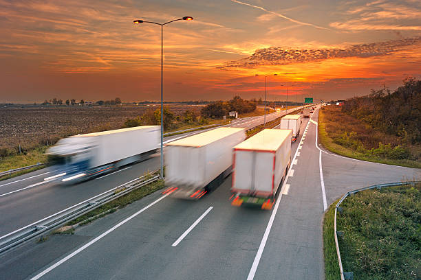 istock Several trucks in motion blur on highway 521320297