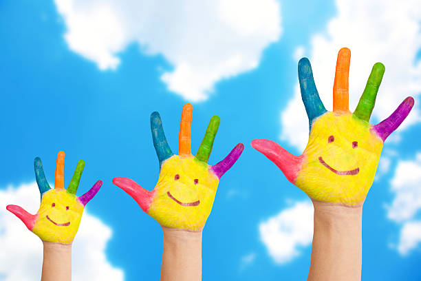 istock Smiling family hands on a sky background. 521321707