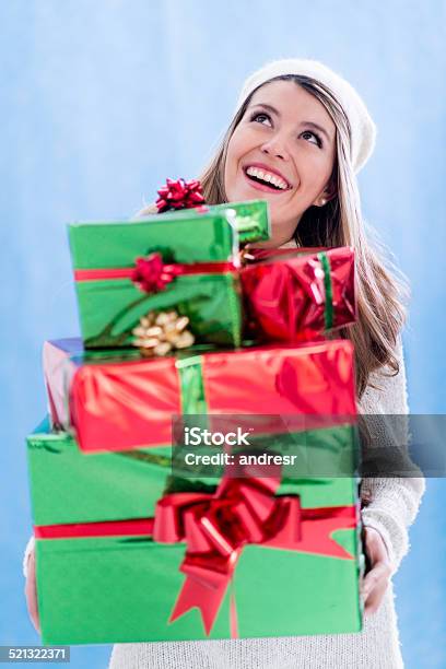 Woman Holding Christmas Gifts Stock Photo - Download Image Now - Christmas, Gift, Stack