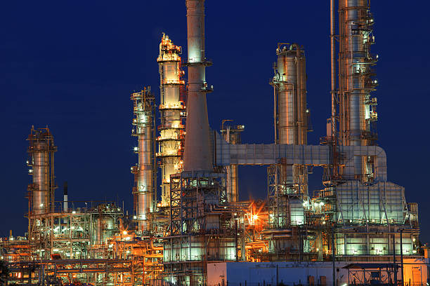 istock oil refinery chimney at night lighting 521322631