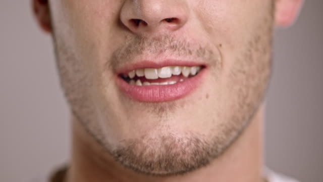 Lips of a young Caucasian man talking